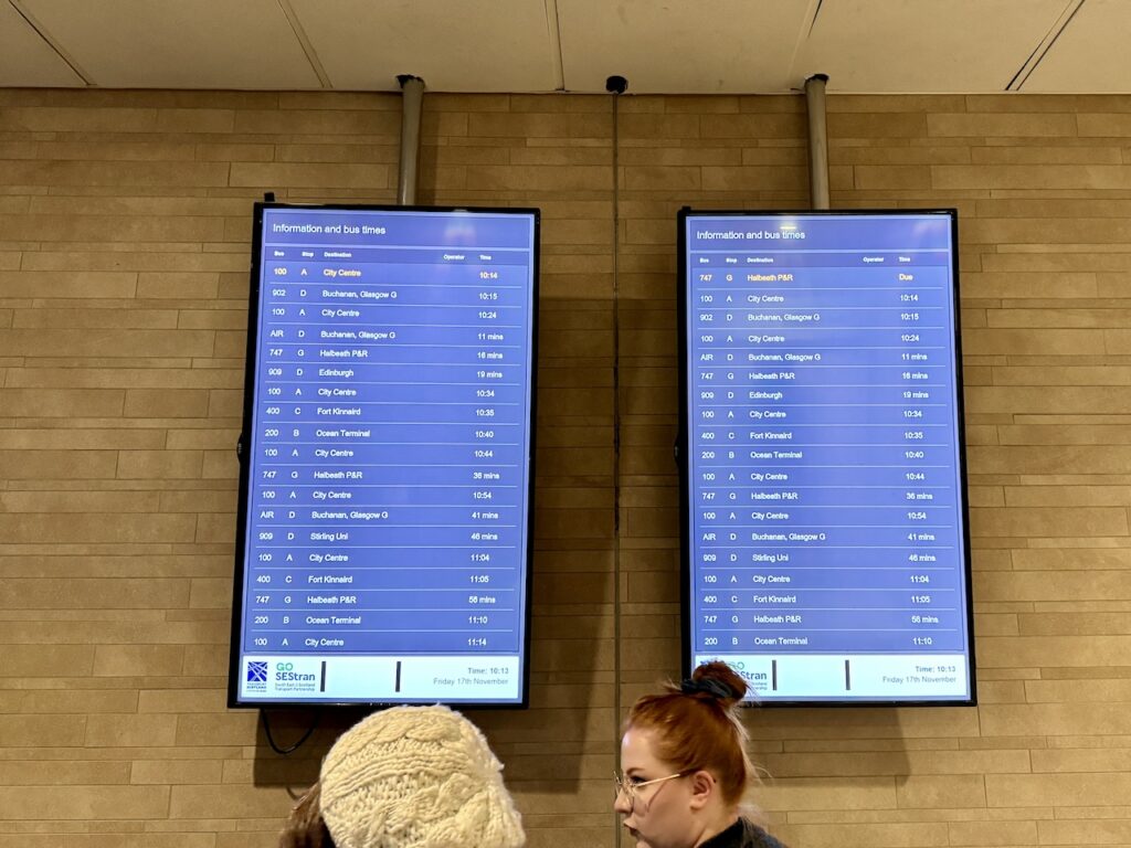 Info screen with bus times at Edinburgh Airport