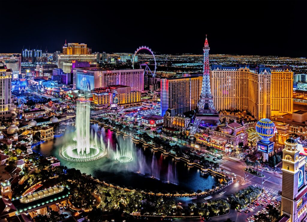 Aerial view of the Bellagio fountains and illuminated hotels on the Las Vegas Strip at night