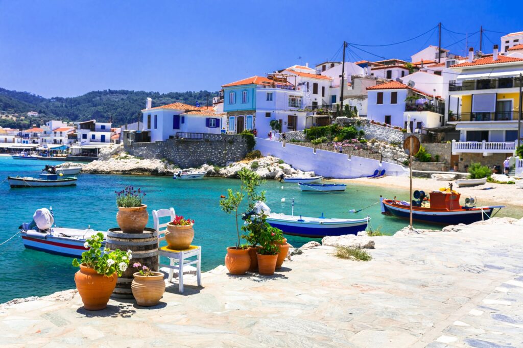 Boats and white houses beside a small bay on Samos