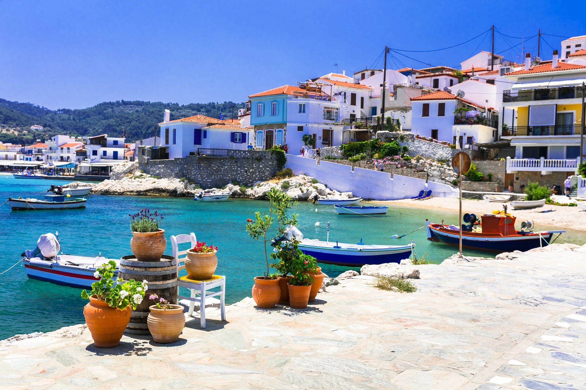 Boats and white houses beside a small bay on Samos
