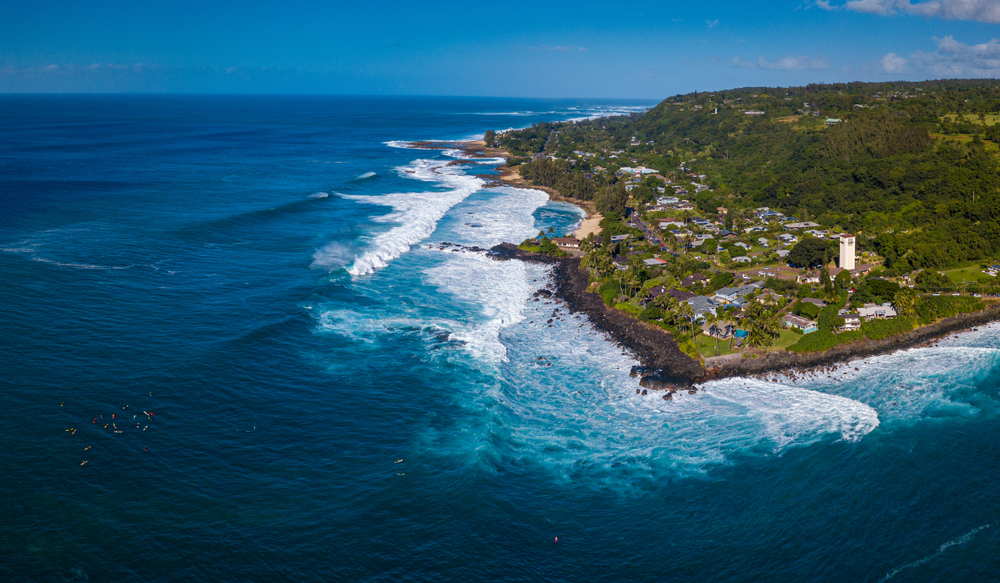 Aerial view of the North Shore on Oahu with surfers at Waimea Bay