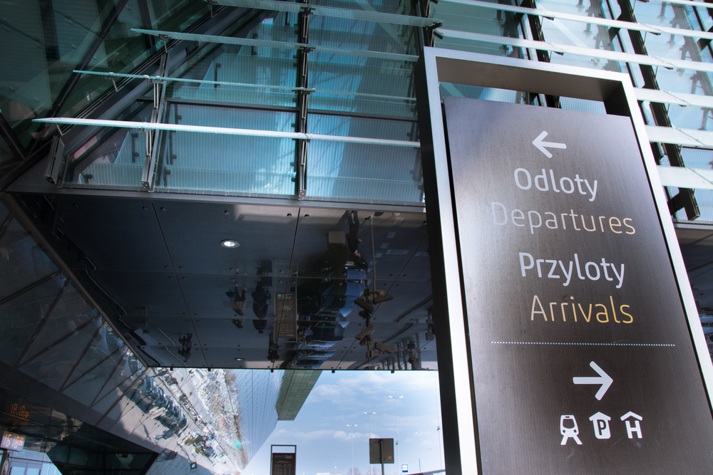 Signs for departures and arrivals at Kraków Airport
