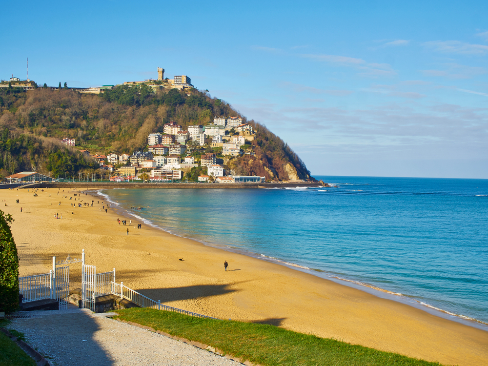 Ondarreta beach with Monte Igueldo behind it, seen from the gardens of Miramar Palace