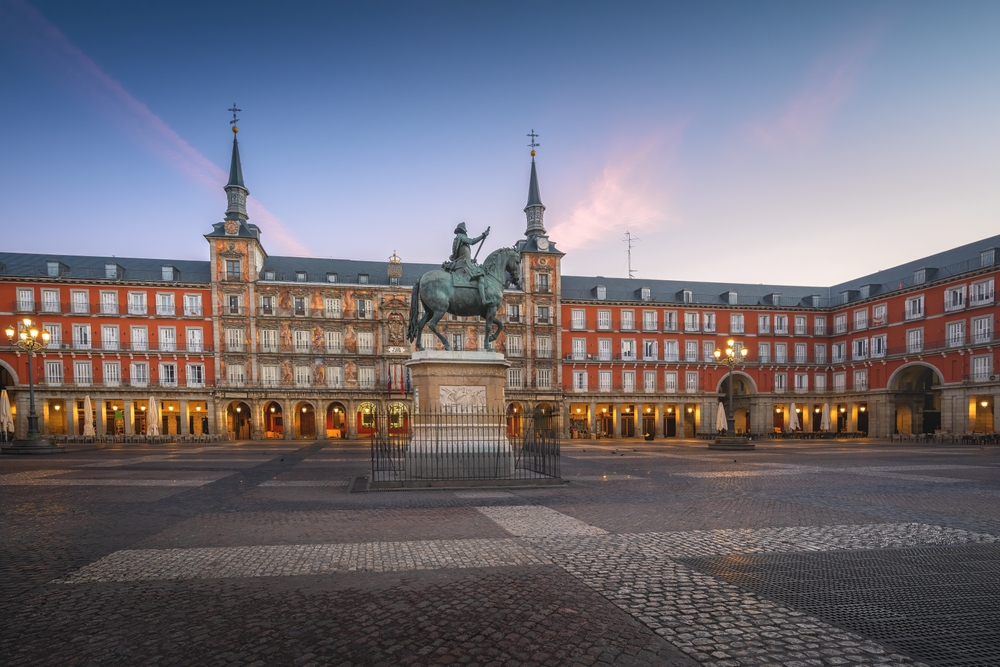 18 Best Things to Do in Madrid: Sights, Prices & Tips 22 Plaza Mayor in Madrid at sunrise with the equestrian statue of Philip III