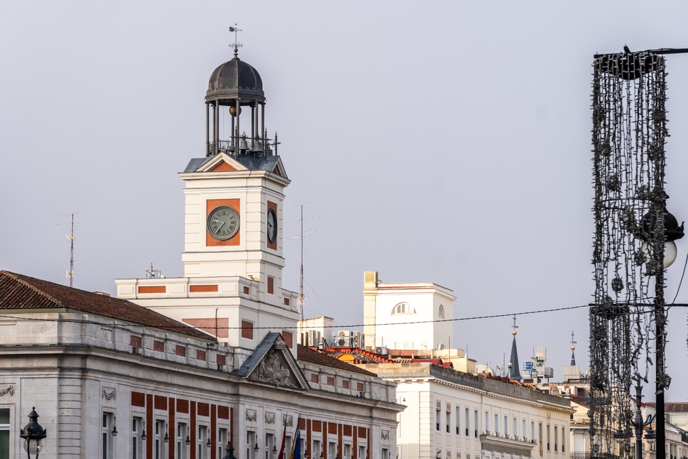 18 Best Things to Do in Madrid: Sights, Prices & Tips 23 Puerta del Sol in Madrid with the clock tower on the Casa de Correos