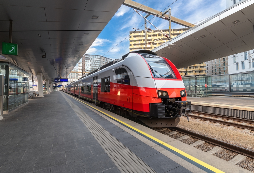 Red train at a station platform in Vienna