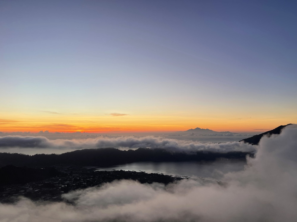 Sunrise from Mount Batur overlooking Lake Batur and Mount Agung