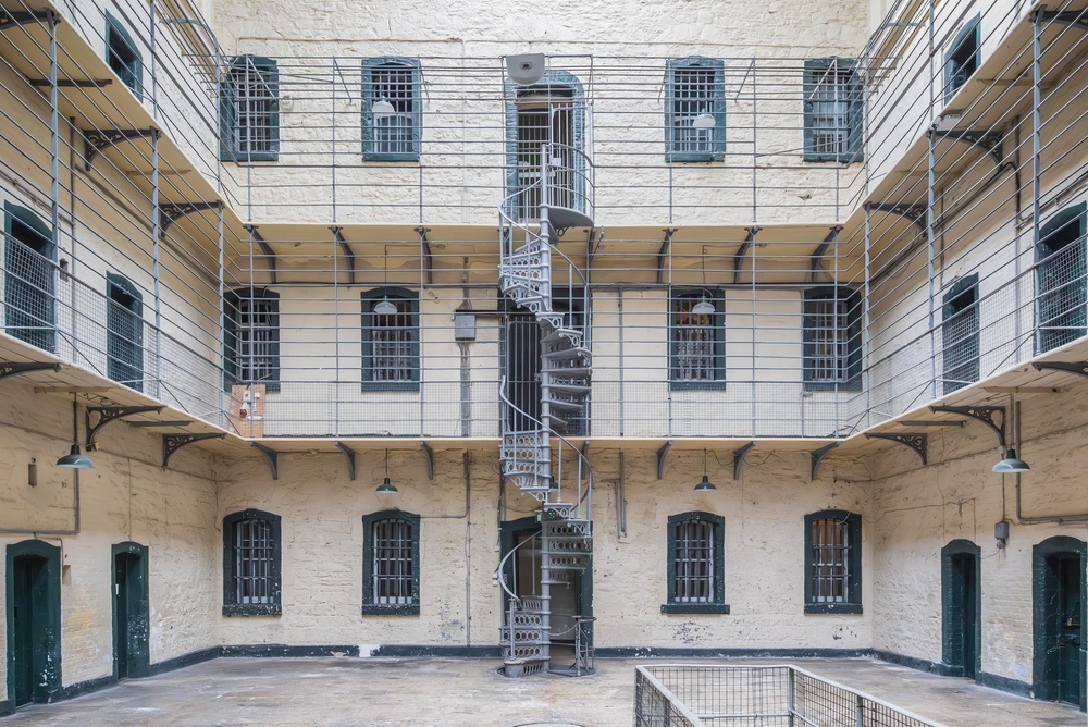 18 Best Things to Do in Dublin: Sights, Prices & Tips 21 The main hall with cells and galleries in Kilmainham Gaol in Dublin