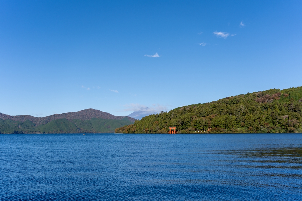 Where to Stay in Japan? The 7 Best Areas & Places to Stay 11 The red torii gate on Lake Ashi in Hakone with Mount Fuji in the background