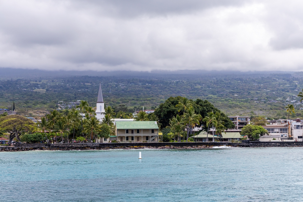 The waterfront in Kailua-Kona with palm trees and a church