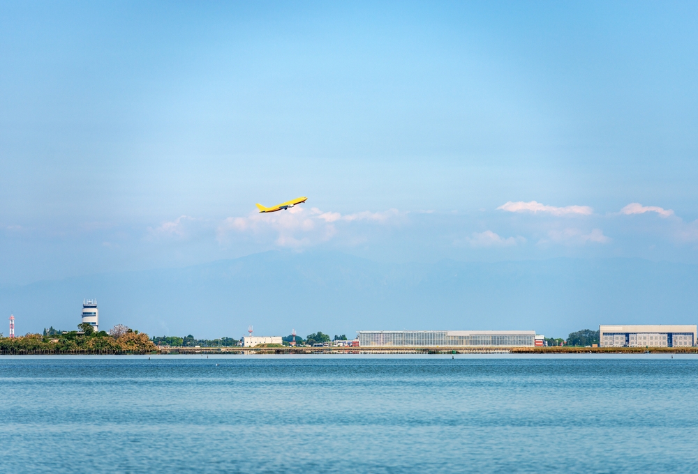 Plane taking off from Marco Polo Airport beside the Venice lagoon