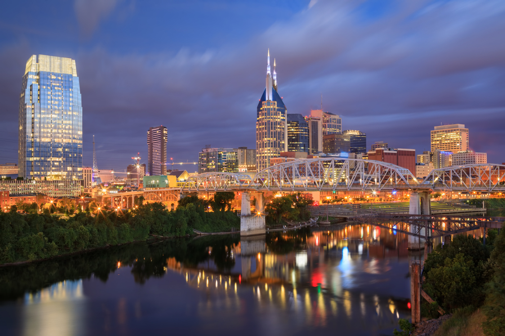 The Nashville skyline and the John Seigenthaler Pedestrian Bridge over the Cumberland River at daybreak