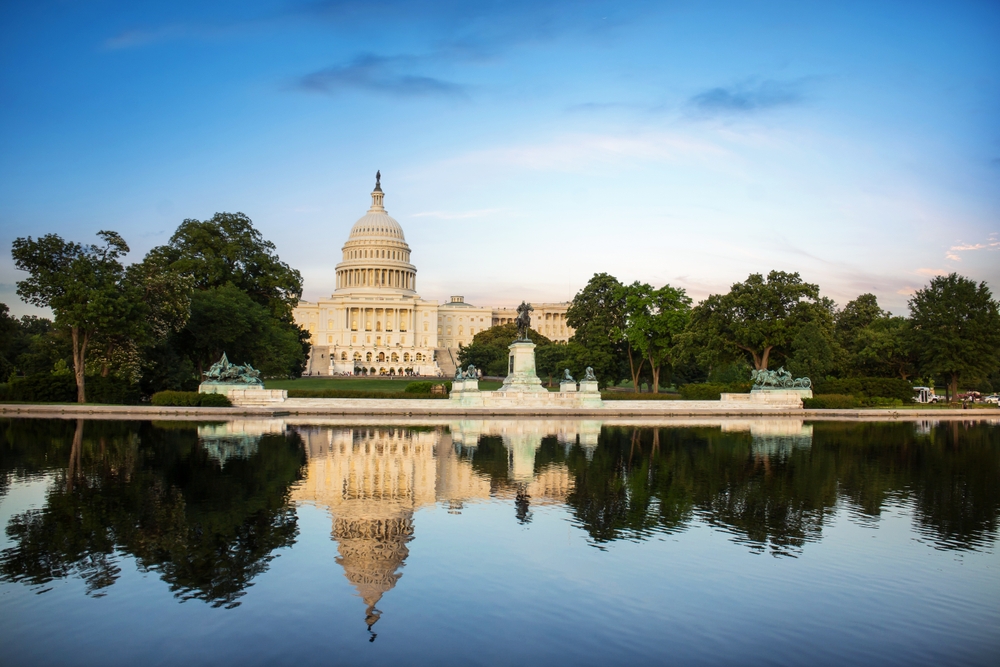 The United States Capitol reflected in the water on the National Mall in Washington, D.C.