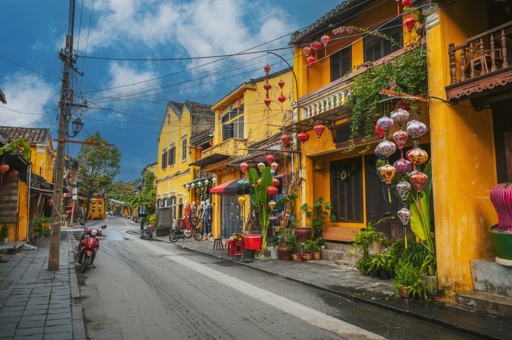 Yellow houses and paper lanterns in a street in the Old Town in Hoi An