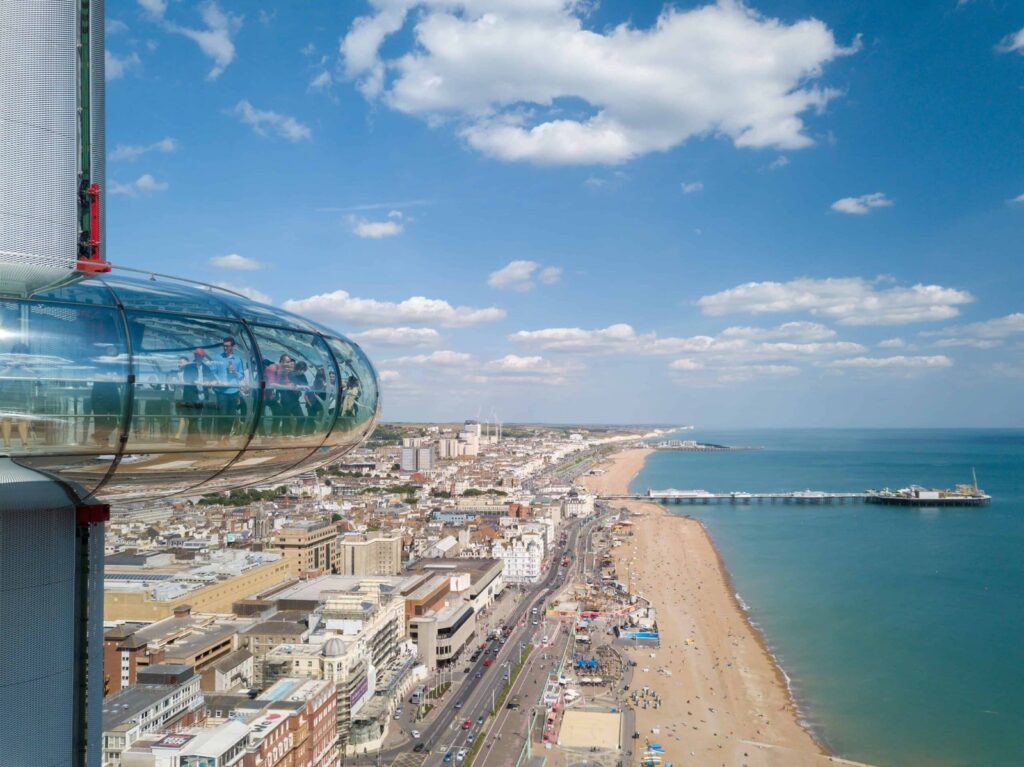 Aerial view of Brighton with the seafront promenade, the beach and Brighton Palace Pier