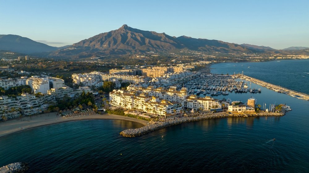 Aerial view of Puerto Banús marina in Marbella with La Concha mountain