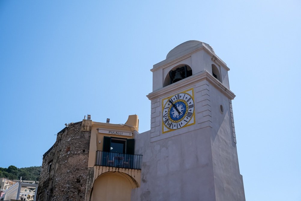 Where to Stay on Capri? The 5 Best Areas & Places to Stay 3 The bell tower on the Piazzetta in Capri Town