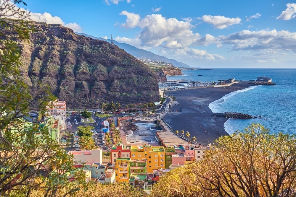 The black sand beach and houses of Puerto de Tazacorte on La Palma