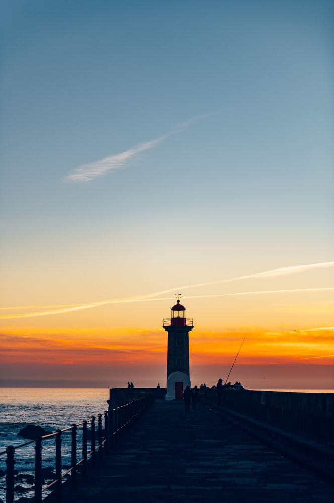 17 Best Things to Do in Porto: Sights, Prices & Tips 16 The Farolim de Felgueiras lighthouse at Foz do Douro in Porto at sunset