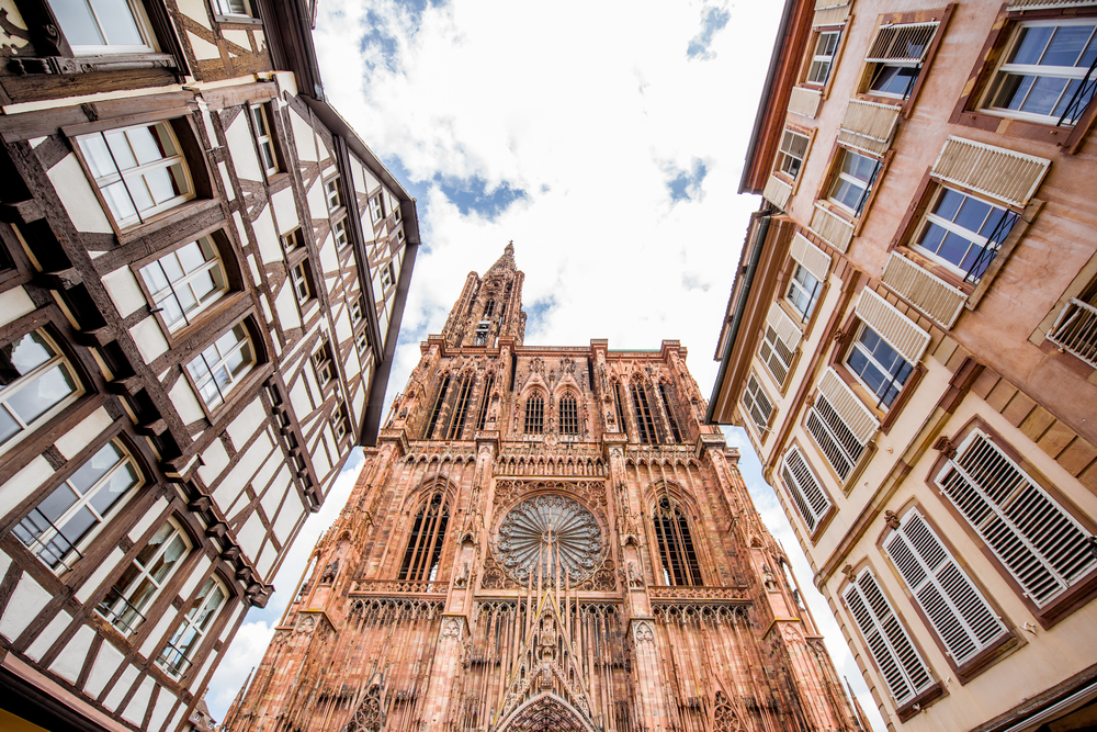 Where to Stay in Strasbourg? The 6 Best Areas & Places to Stay 3 Street with old houses and Notre-Dame Cathedral on Grande Île in Strasbourg