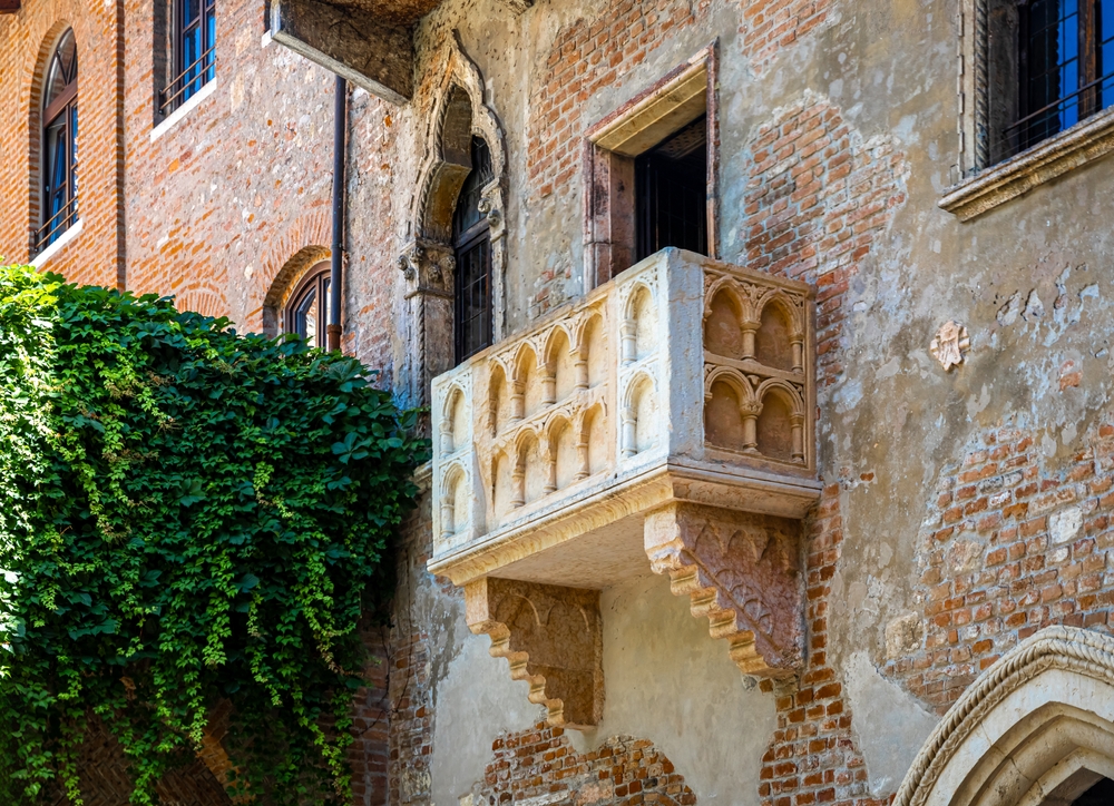 Juliet's balcony in Verona with stone walls and ivy