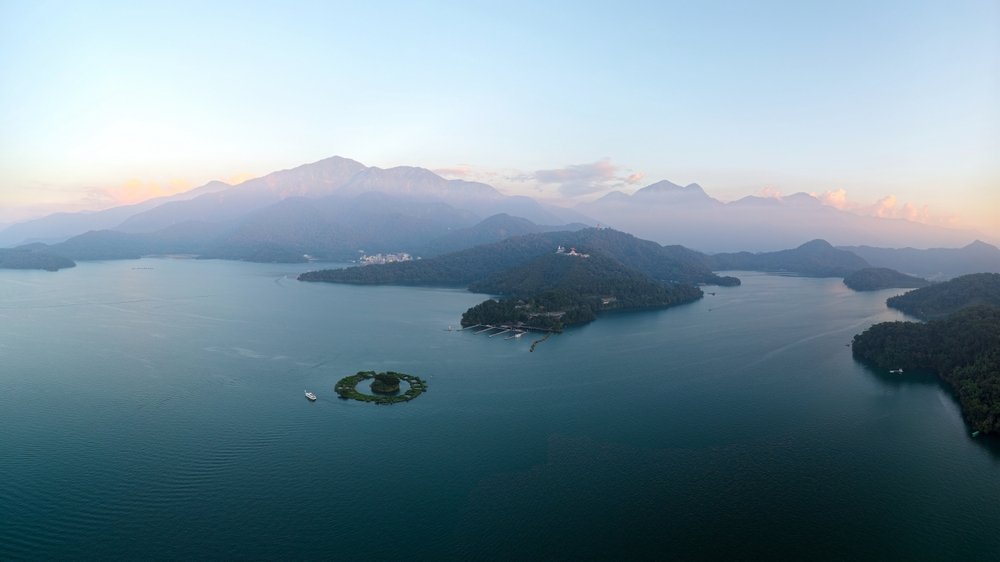 Where to Stay in Taiwan? The 7 Best Areas & Places to Stay 6 Lalu Island in Sun Moon Lake with the mountains surrounding the lake