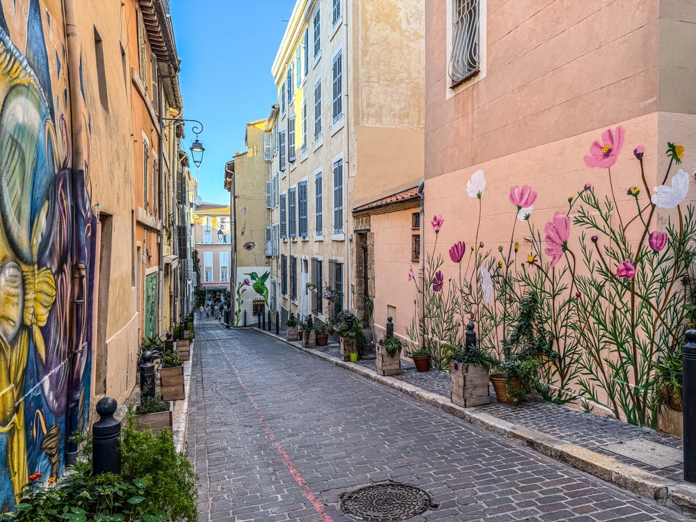 Cobbled street with street art in Le Panier in Marseille