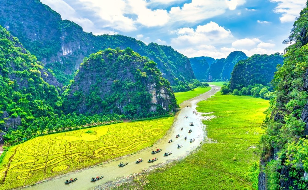 Limestone karsts and rice paddies along the Ngo Dong River at Tam Coc in Ninh Binh