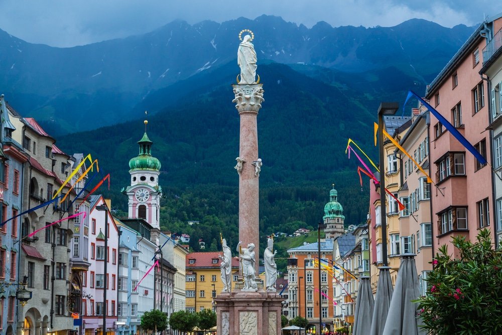 Maria-Theresien-Straße in Innenstadt, Innsbruck, with the Nordkette mountains in the background