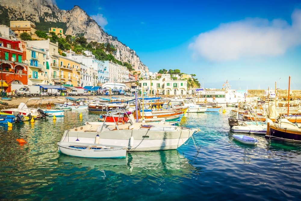 Where to Stay on Capri? The 5 Best Areas & Places to Stay 5 Marina Grande harbour with boats and colourful houses on Capri