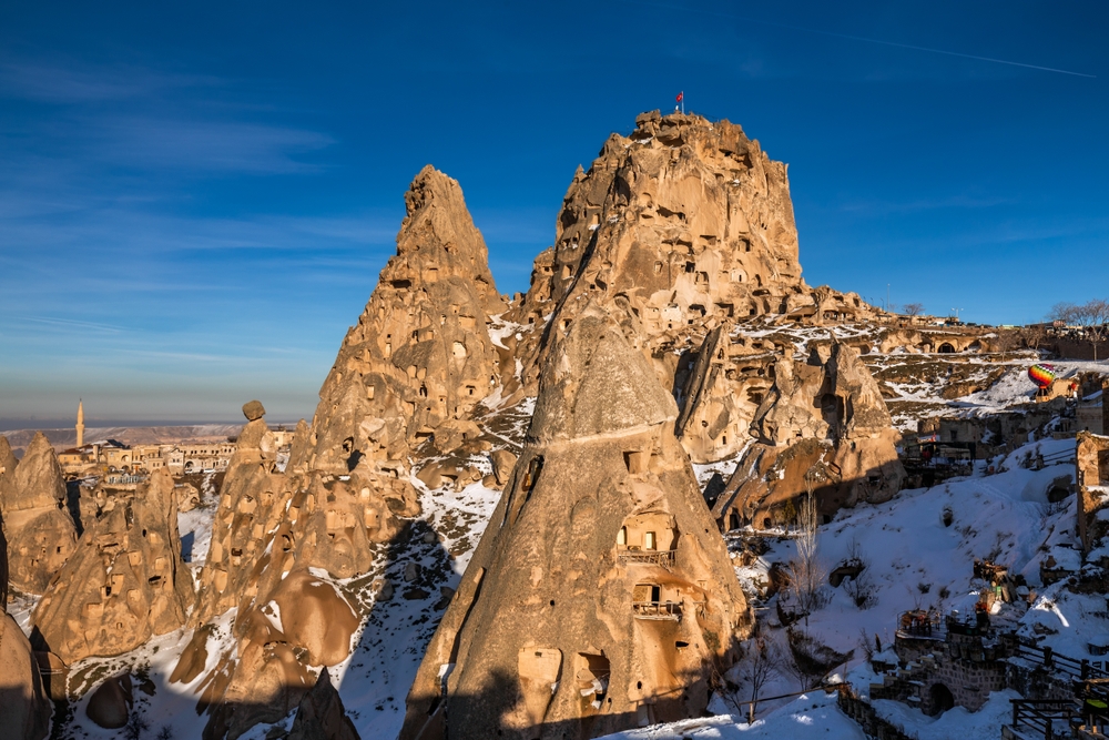 Panorama of Ortahisar Castle with a mosque and the Old Town in Cappadocia