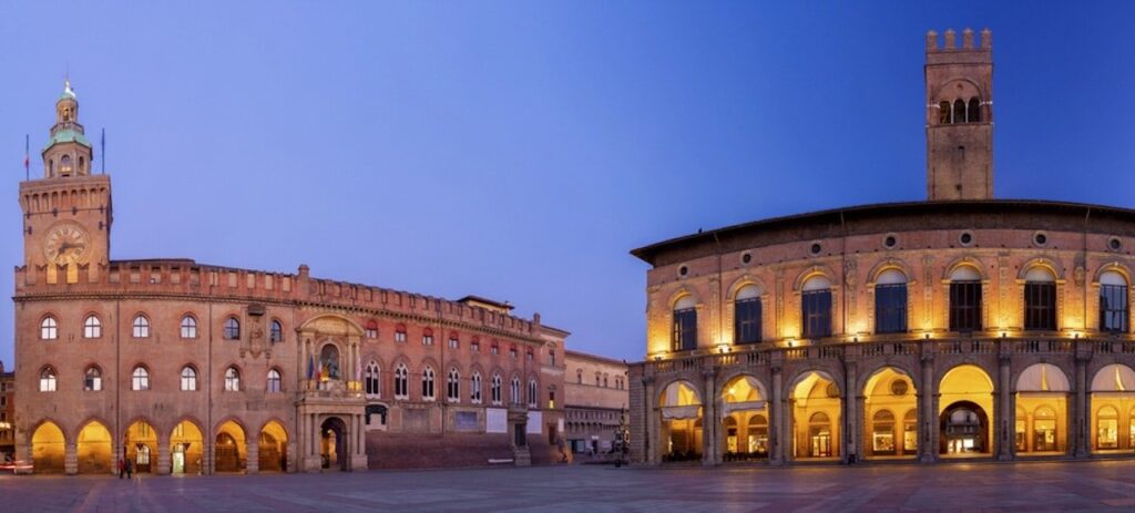 Piazza Maggiore with Palazzo d'Accursio and Palazzo del Podestà in Bologna in the evening