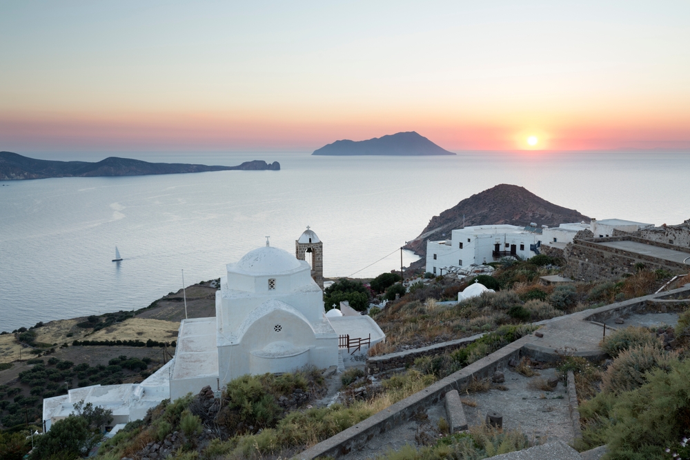 White church and the bay seen from the castle in Plaka