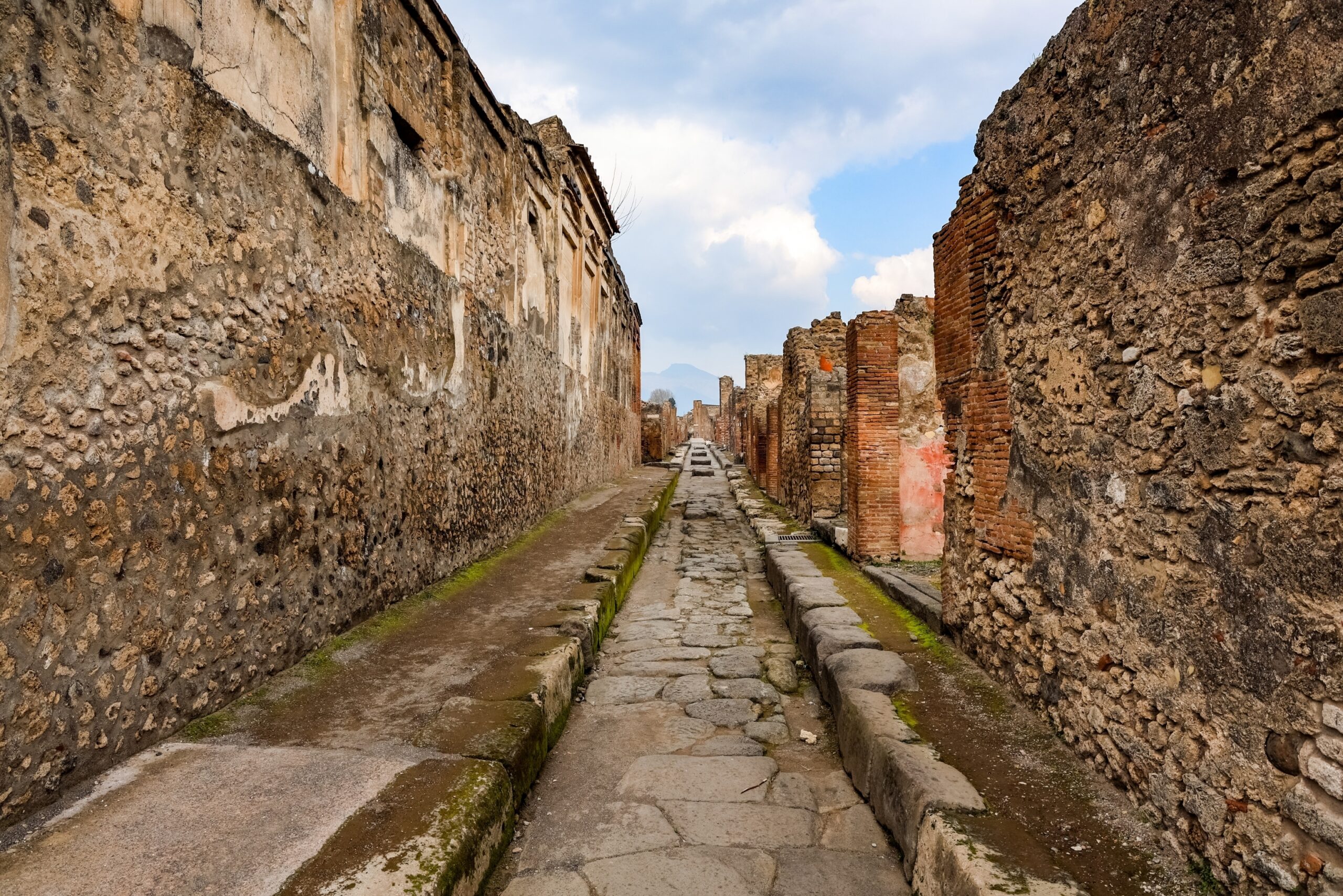 A Roman street in Pompeii with Vesuvius at the end