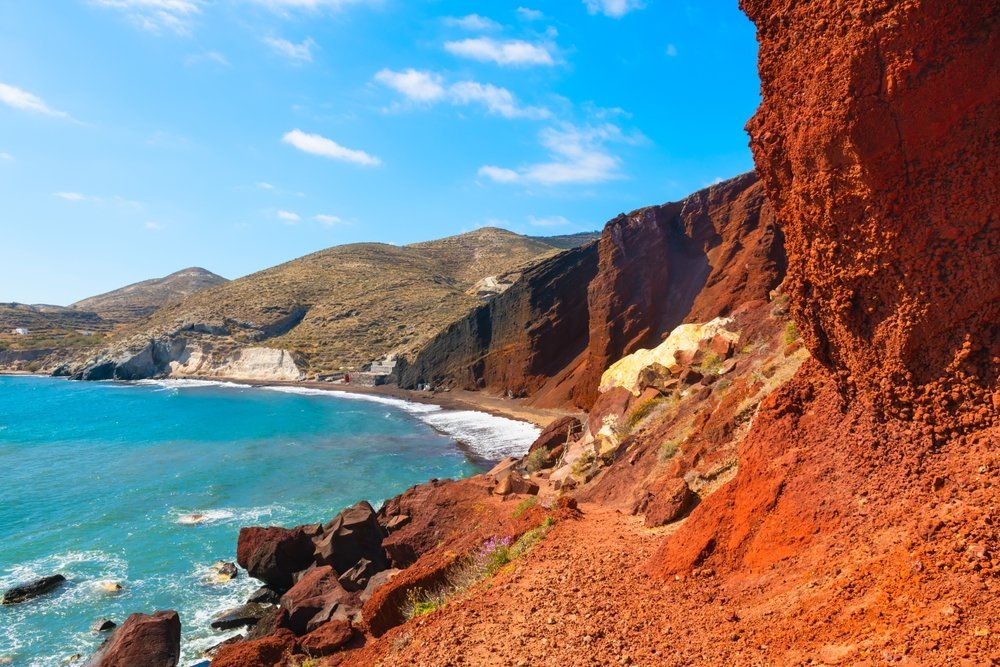 Red Beach with red volcanic cliffs and blue sea