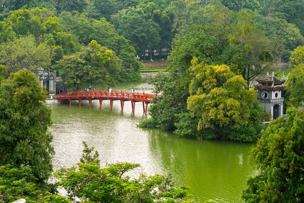 The red The Huc Bridge over Hoan Kiem Lake in Hanoi