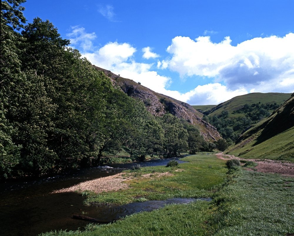 The River Dove winding through the limestone valley of Dovedale north of Ashbourne