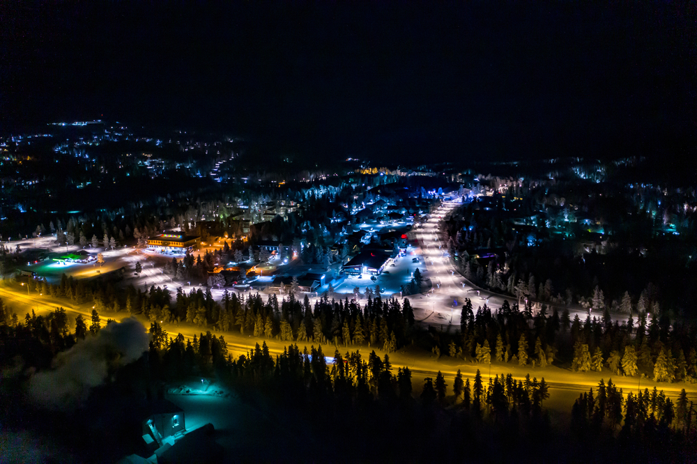 Aerial view of Saariselkä in the evening with colourful lights in Lapland