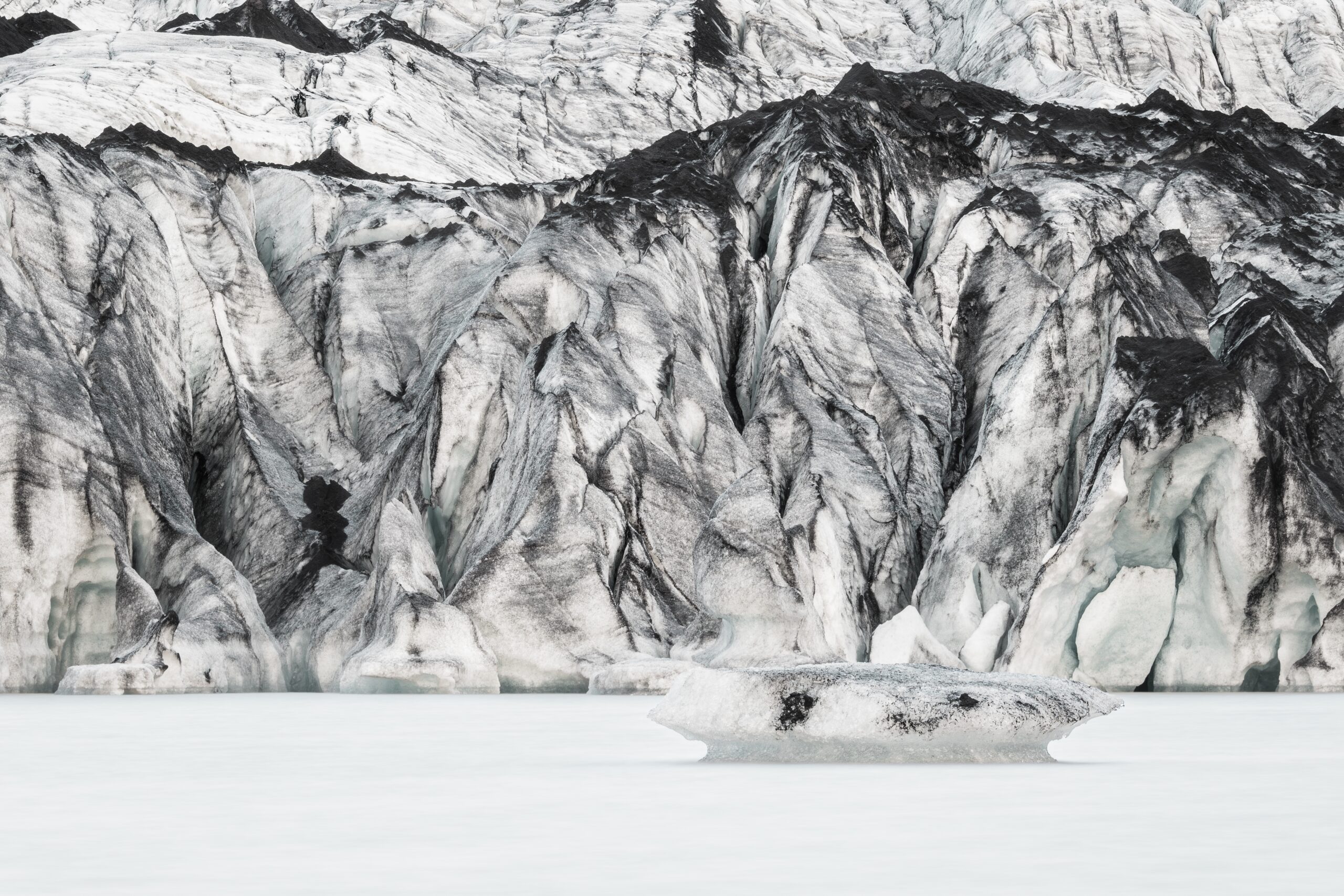 The Sólheimajökull glacier with ice and black volcanic ash