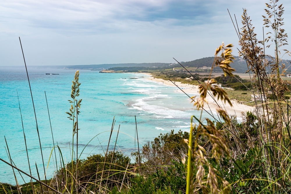 Where to Stay in Menorca? The 6 Best Areas & Places to Stay 12 Son Bou beach in Menorca with turquoise water