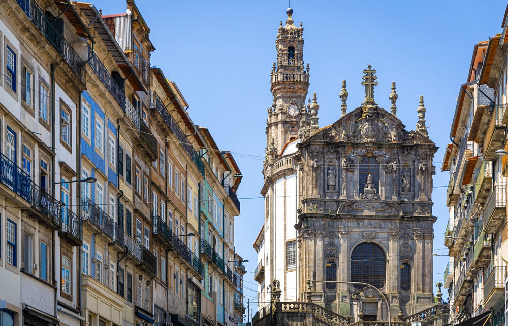 17 Best Things to Do in Porto: Sights, Prices & Tips 8 The Torre dos Clérigos tower rising above the rooftops of Porto