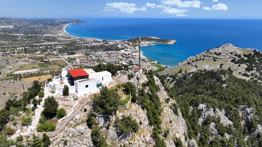 Aerial view of the Panagia Tsambika chapel on the mountain above the bay on Rhodes