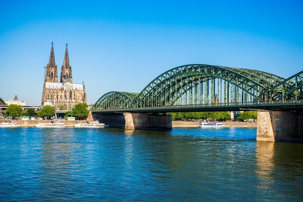 Cologne Cathedral and the Hohenzollern Bridge seen across the Rhine in Cologne