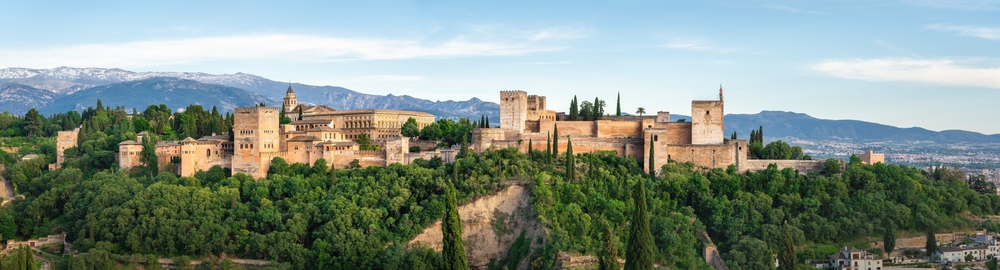 Panoramic view of the Alhambra in Granada with the Sierra Nevada mountains in the background